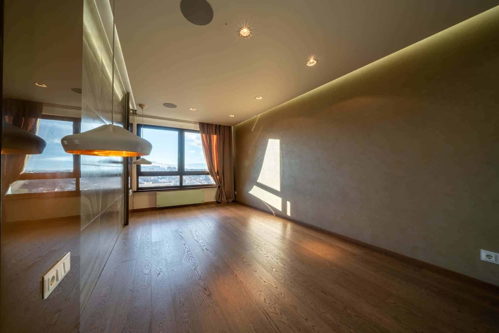 Luxury front room with window. Brown empty room with wardrobe and city landscape in large window